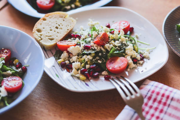 istock Arugula salad with soft cheese, sweetcorn, pomegranate and cherry tomatoes 1193251002
