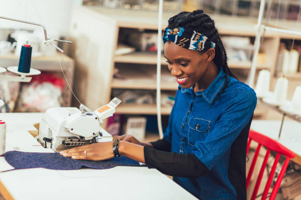 istock Dressmaker woman working with sewing machine 1193251444