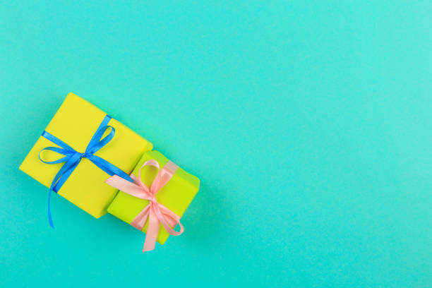 istock Gift box with ribbon and bow on color background and space for text. Top view 1193254120