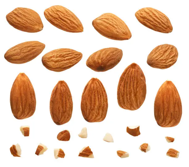 Close up of Almonds nut with pieces isolated on white