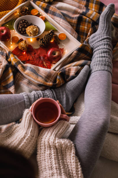 istock Lower section on unrecognizable young woman enjoying a cup of tea 1193256485