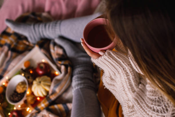 istock Warming hands on a cup of tea and relaxing 1193256490