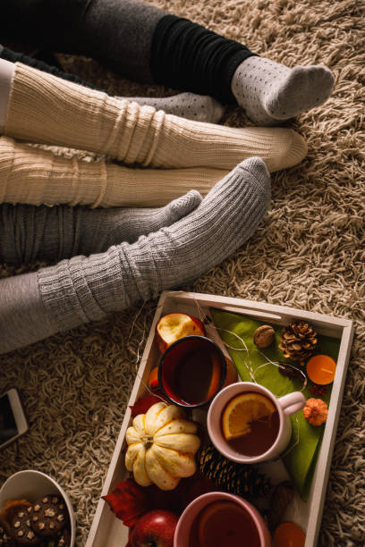 istock Cozy socks and warm tea in autumn 1193256694