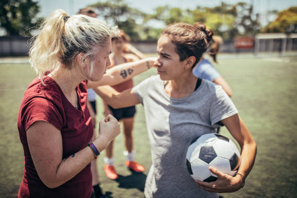 Women soccer players on soccer field Group of women, female soccer players together outdoors on soccer field. football player girlfriend stock pictures, royalty-free photos & images