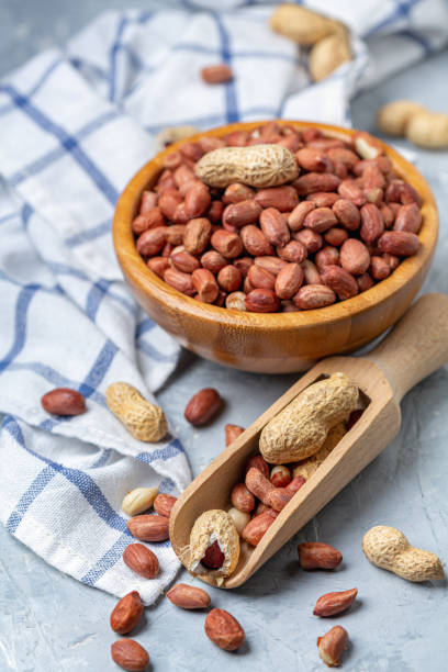 istock Organic peanuts in a wooden scoop. 1193258251