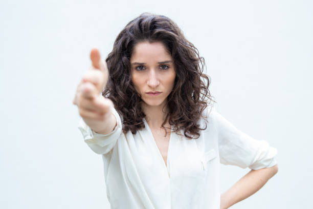istock Strict serious woman making hand gun shot gesture 1193260232