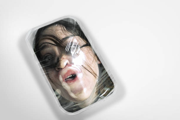 istock Human head as a goods in plastic box isolated on white background, ecology concept 1193262053
