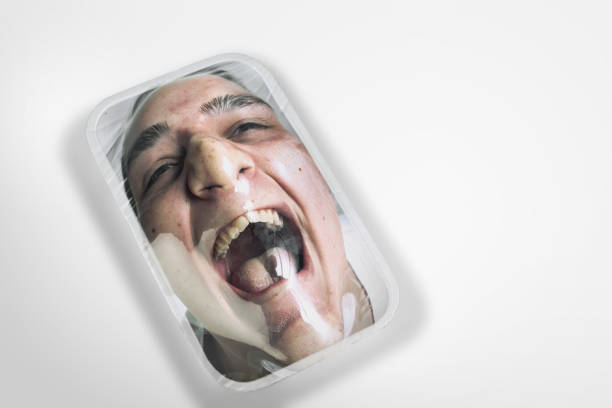 Human head as a goods in plastic box isolated on white background, ecology concept Nightmare. Human head as a goods in plastic box on white background, eco concept. We're selling our organic future. Natural disaster, environmental problems, polymers pollution. Suffocating in garbage. woman strangles man stock pictures, royalty-free photos & images