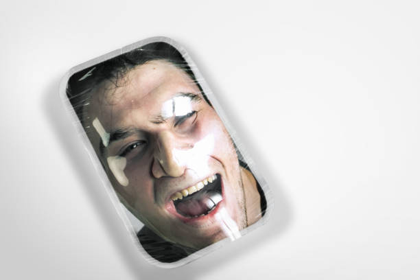 Human head as a goods in plastic box isolated on white background, ecology concept Cry. Human head as a goods in plastic box on white background, ecology concept. We're selling our organic future. Natural disaster, environmental problems, polymers pollution. Suffocating in garbage. woman strangles man stock pictures, royalty-free photos & images