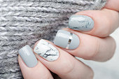 grey manicure with marble print and silver details