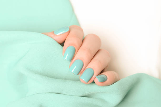 istock mint manicure on a mint and white background 1193268890