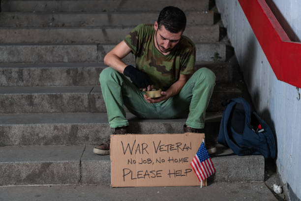 istock War Veteran is Sitting on the Stairs and Begging for Help 1193269250