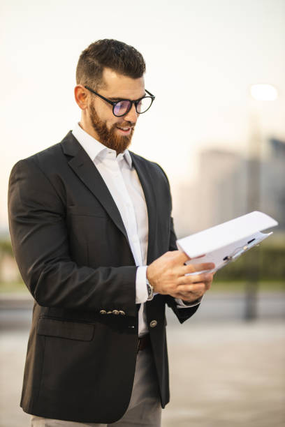 istock Entrepreneur holding contracts 1193269296