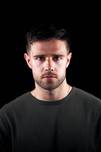 istock Studio Portrait Of Young Man With Serious Expression Looking At Camera 1193269463