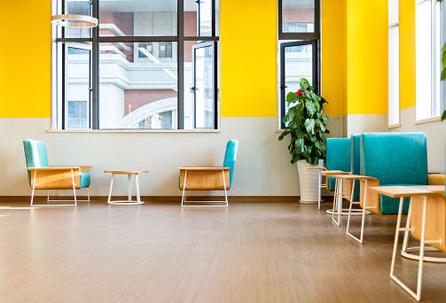 Chairs and coffee tables in modern library.