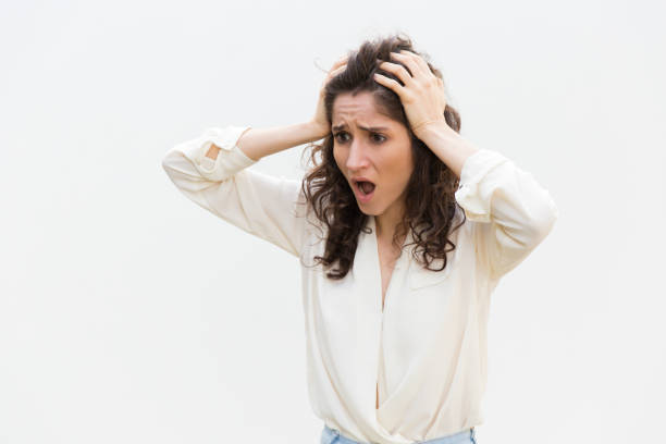 istock Shocked disappointed woman gasping, holding head 1193270836