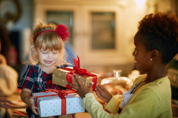 istock Future best friends exchanging Christmas gifts 1193270884