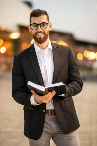 istock Entrepreneur holding and reading a book 1193271685