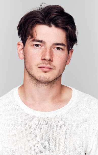 istock Studio Portrait Of Young Man With Serious Expression Looking At Camera 1193271872