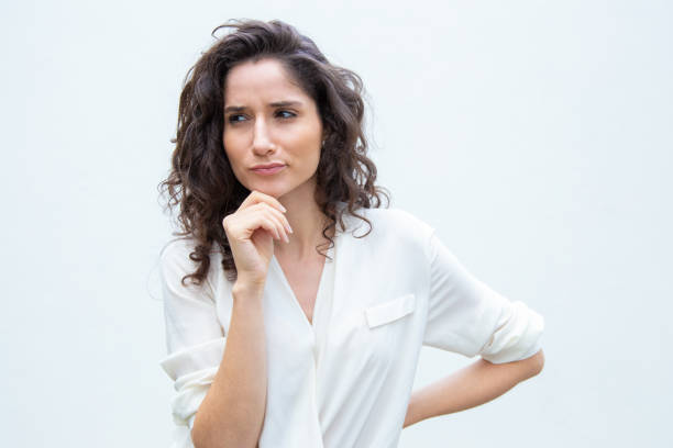 istock Pensive female customer touching chin 1193272150