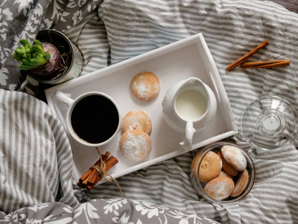 istock breakfast in bed. top view. Coffee with cookies on a tray 1193272167