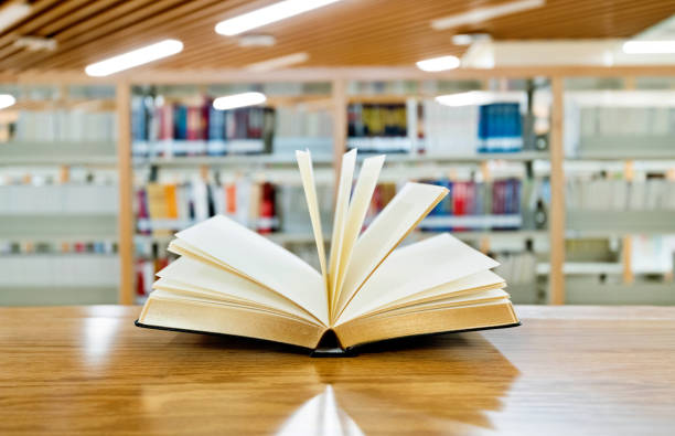 istock An open book on the table of public library 1193273392