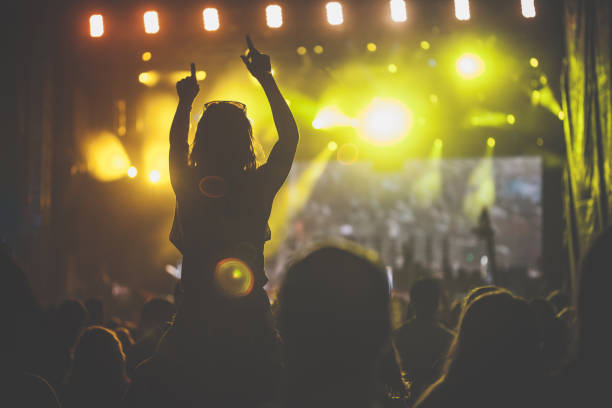 istock People dancing and having fun on a rock concert 1193274700