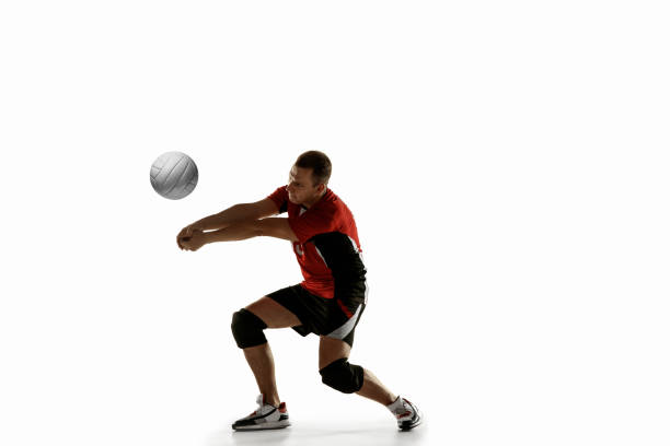 istock Young caucasian volleyball player placticing isolated on white background 1193274965
