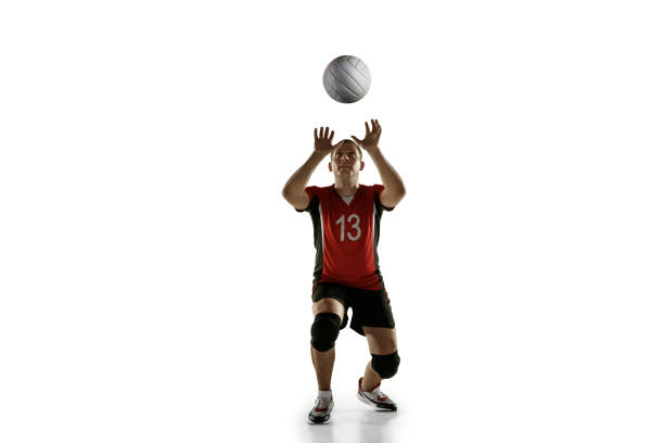 istock Young caucasian volleyball player placticing isolated on white background 1193274993