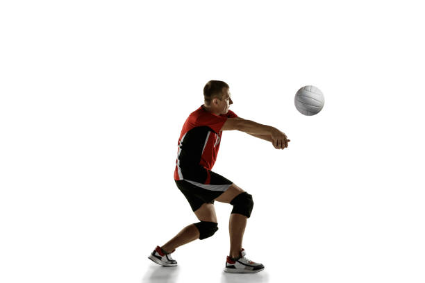istock Young caucasian volleyball player placticing isolated on white background 1193274999
