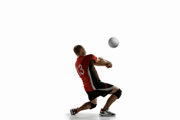 istock Young caucasian volleyball player placticing isolated on white background 1193275000