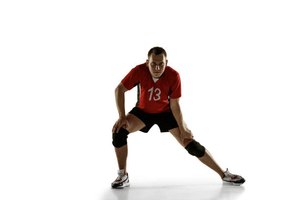 istock Young caucasian volleyball player placticing isolated on white background 1193275039