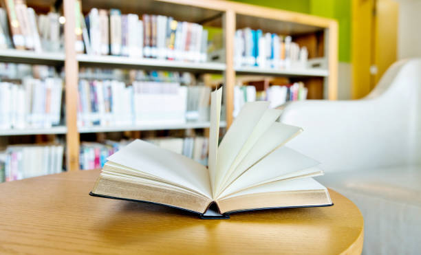 istock An open book on the table of public library 1193275130