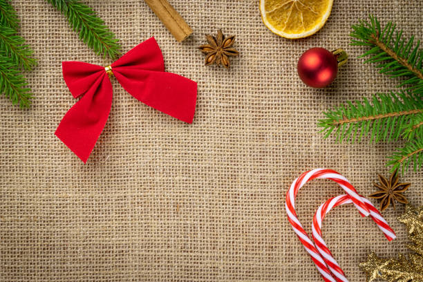 istock New Year Background Red decorations isolated on linen texture.Xmas celebration pattern.Holiday festive celebration concept.Banner mock up for display of product or design content 1193276221