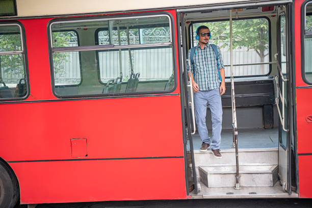 istock Young Man with Headphones is Exiting the Bus 1193277851