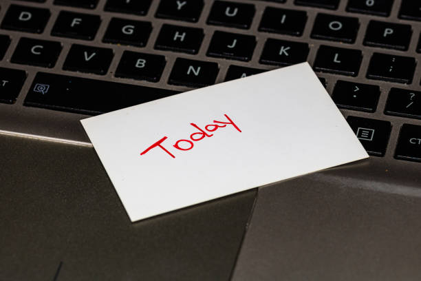 istock Writing on white label Today. Text with Today on a label on keyboard. 1193278035