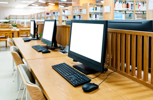 istock Computers and bookshelves in modern library 1193278240