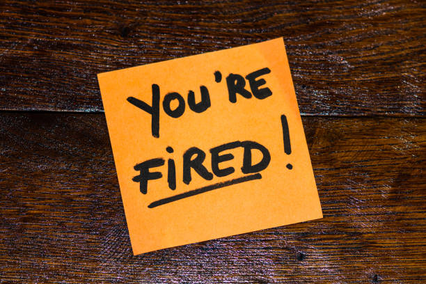 istock Writing on colorful sticky note you are fired. Text with you are fired on paper. 1193278261