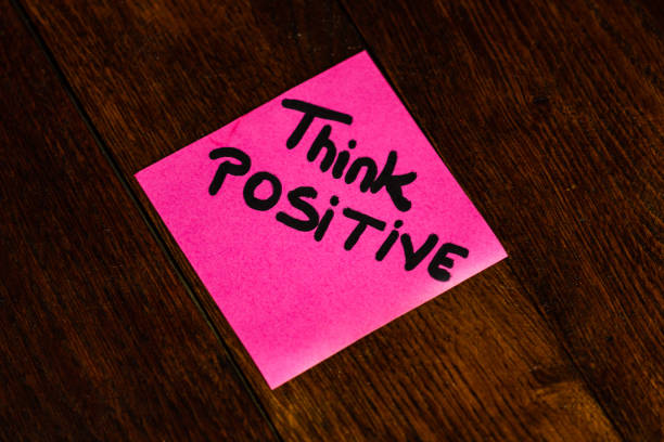 istock Writing on colorful sticky note Think positive. Text with Think positive on paper. 1193278275