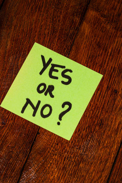 istock Writing on colorful sticky note Yes or No? Text with question Yes or No? on paper. 1193278335