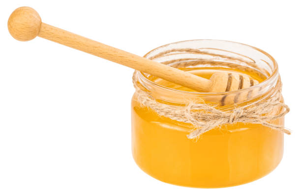 istock Honey pot and dipper isolated on white background 1193278387