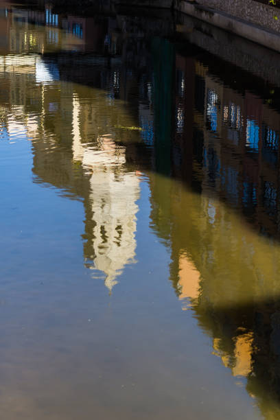 Girona's cathedral main landmark reflected on river quiet waters