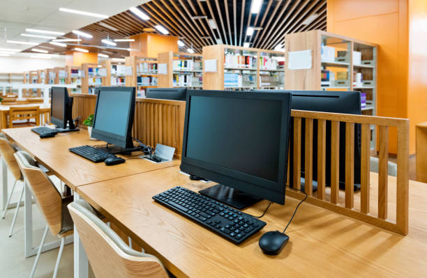 istock Computers and bookshelves in modern library 1193279827