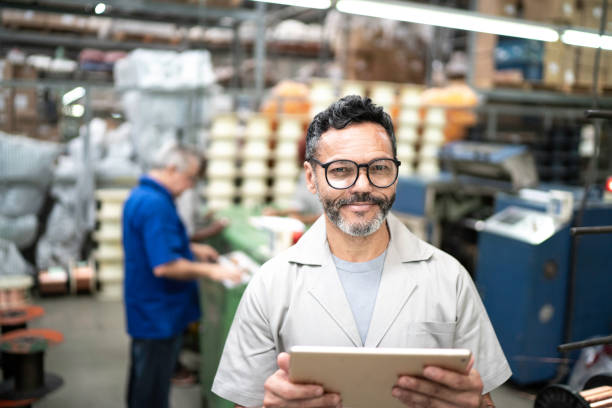 istock Portrait of a happy employee using digital tablet 1193280950