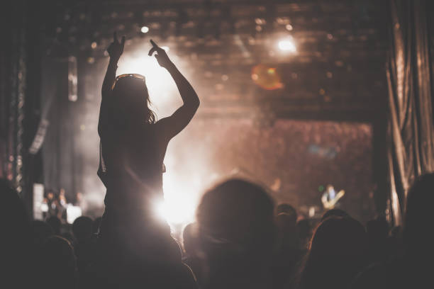 istock Large crowd dancing and having fun on an outdoors music festival 1193281097