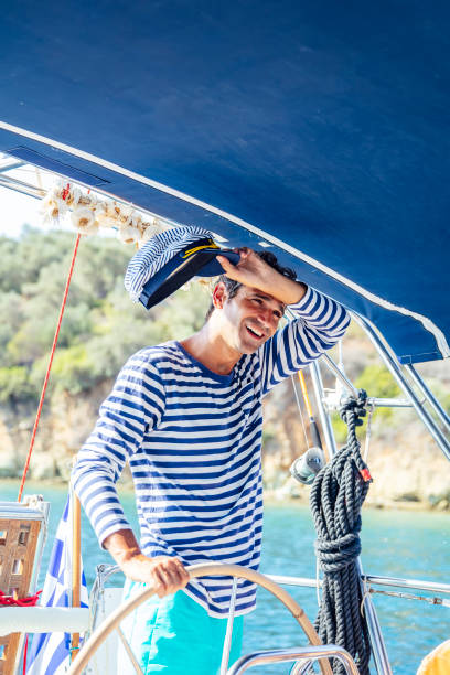 istock Handsome young man on a sailboat 1193284578