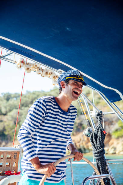 istock Handsome young man on a sailboat 1193284580