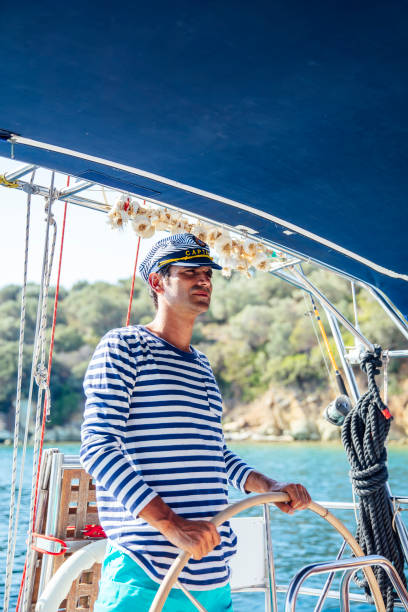 istock Handsome young man on a sailboat 1193284581