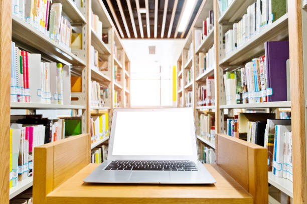 istock Blank laptop on the table of library 1193287838