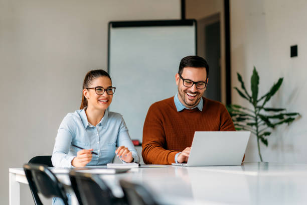 istock Happy businesspeople working together in the office 1193287914